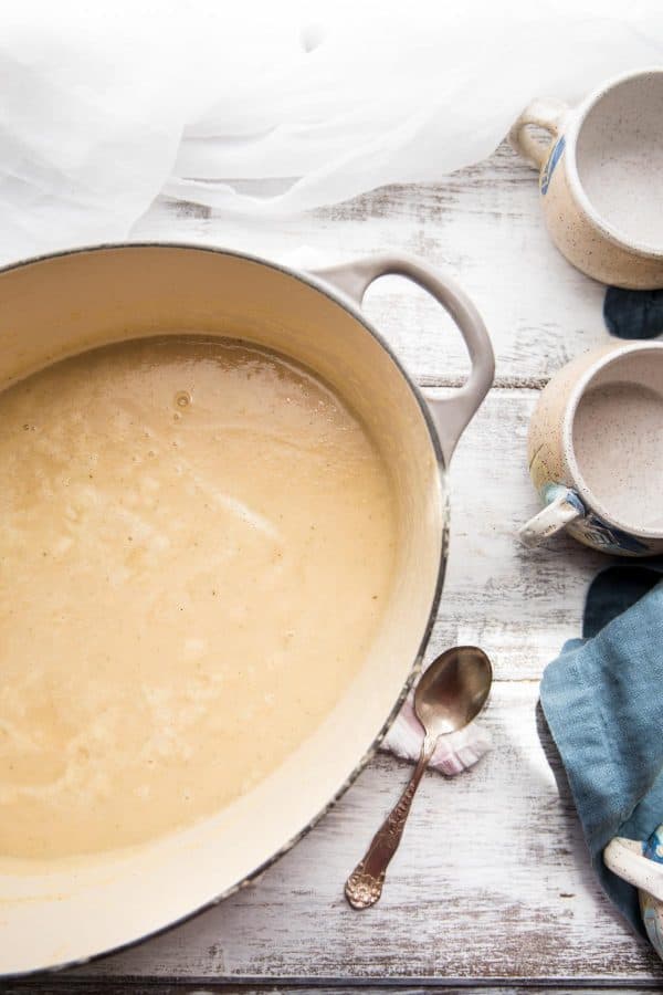 overhead photo of parsnip soup blended in a dutch oven