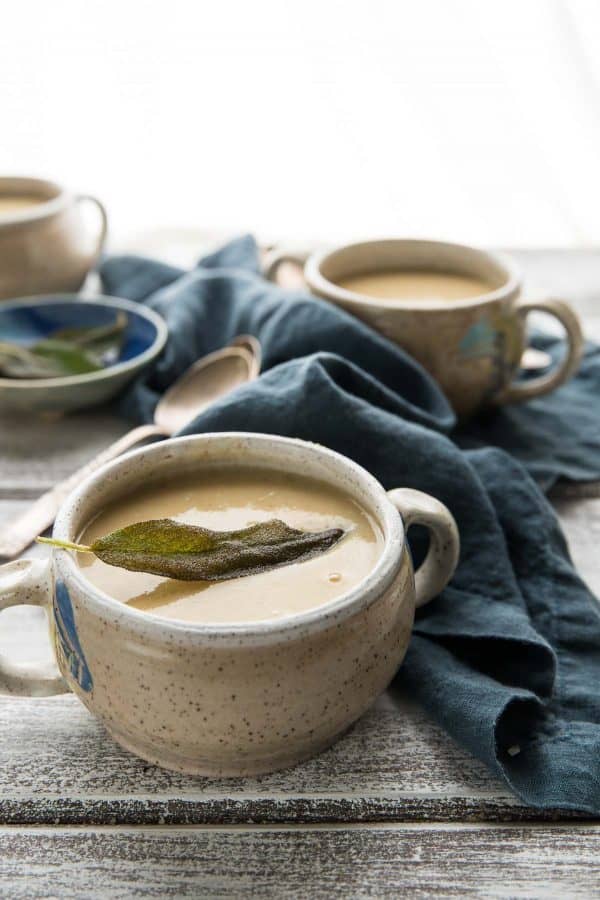 side shot of fried sage on white bean and parsnip soup