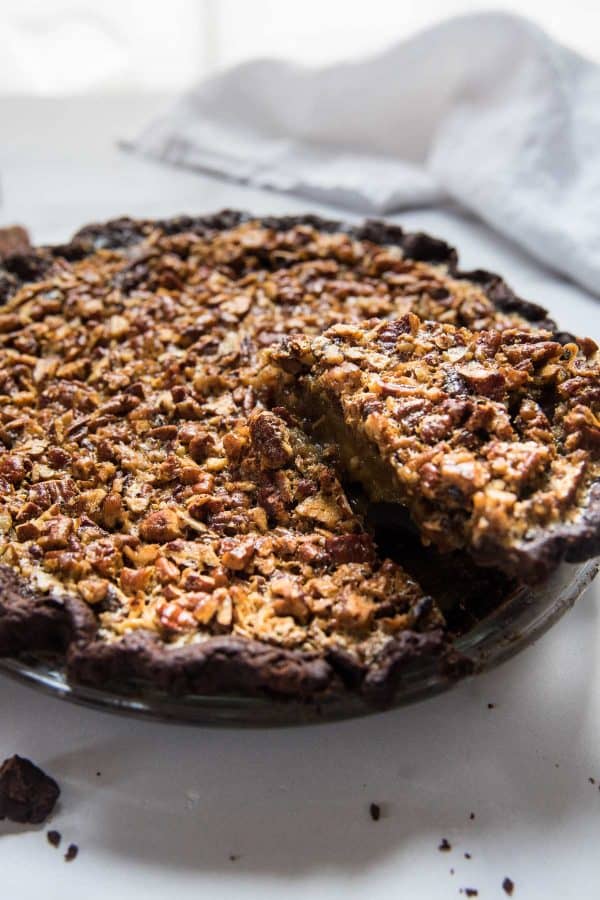 slice of pecan pie coming out of the pie dish