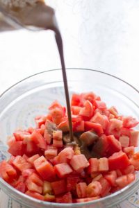 Bruschetta tomatoes drizzled with balsamic vinaigrette