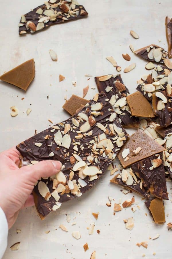 breaking apart buttercrunch toffee by hand