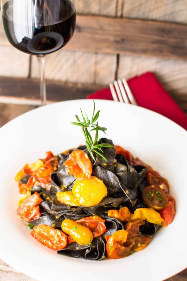 squid ink pasta plated in a large bowl