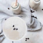 overhead shot of coffee milk martini with coffee beans