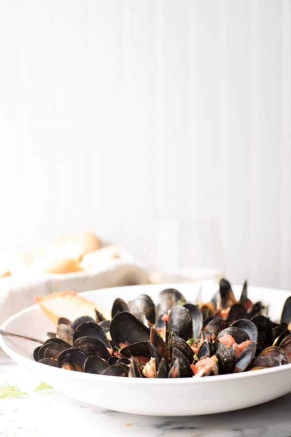 Mussels Fra Diavolo in a bowl with crusty bread