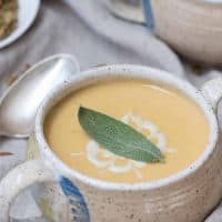 sage leaf and cashew sage crema on top of soup