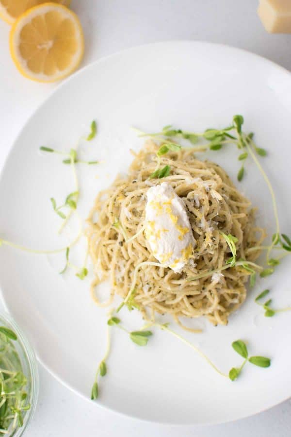 overhead of Creamy Lemon Ricotta Pesto with pea shoots