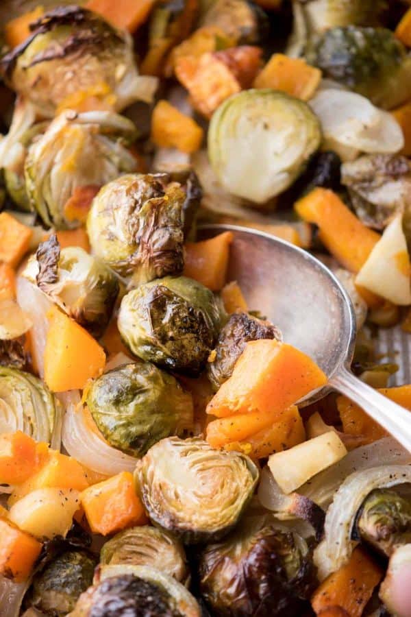 close up of spoon scooping winter veggies