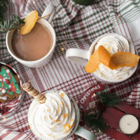 coffee mugs with coffee and whipped cream