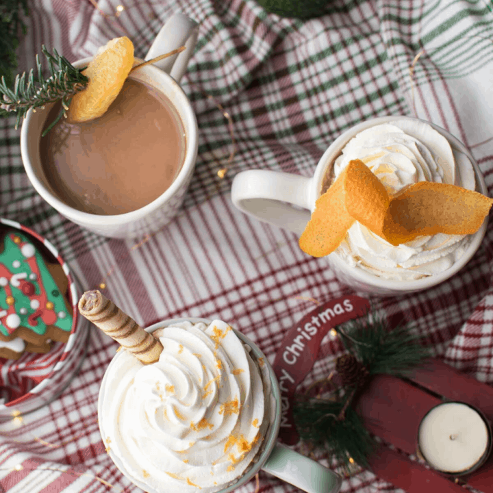 coffee mugs with coffee and whipped cream