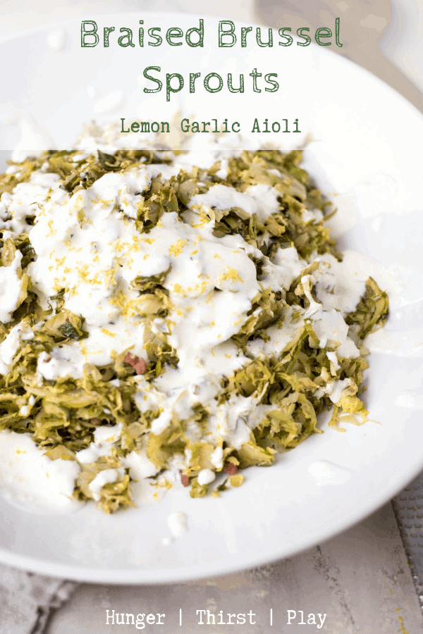 Thinly shaved brussel sprouts make for a super quick side dish by braising them. Creamy, lemon garlic aioli is the perfect, flavorful topping. #sidedish #brusselsprouts #aioli