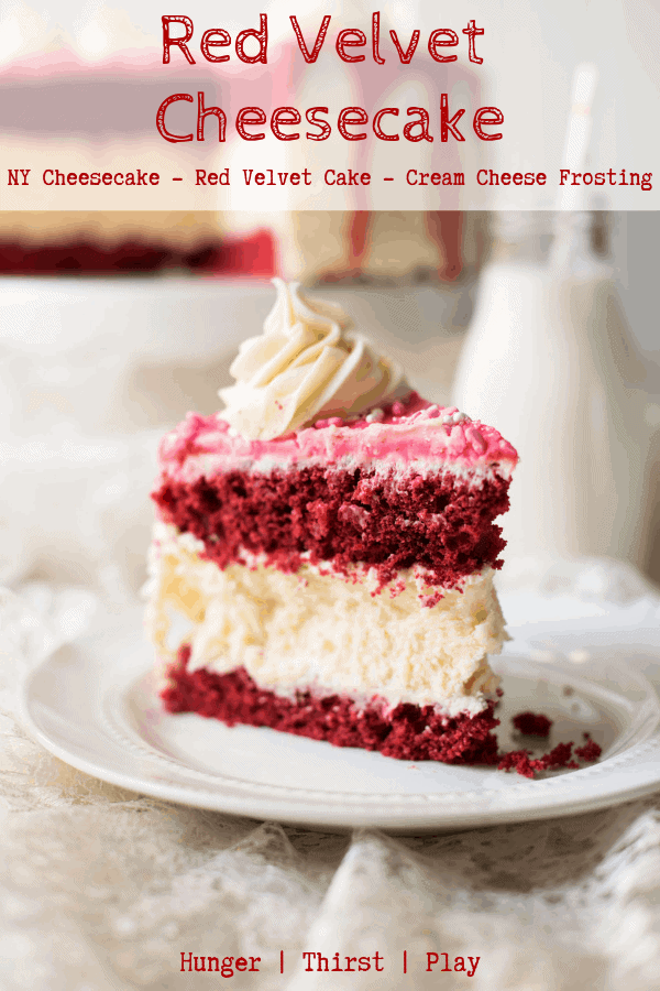 A decadent way to say I Love You on Valentines Day - with cake! Creamy New York style cheesecake sandwiched between layers of tender red velvet cake decorated with cream cheese frosting. #redvelvetcake #cheesecakerecipes