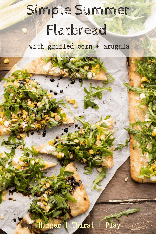 This super quick flatbread is the best for leftover corn on the cob! Creamy cheese, spicy arugula and sweet corn on a pre-baked flat bread for a super quick appetizer or dinner! #easyflatbreads #cornonthecob