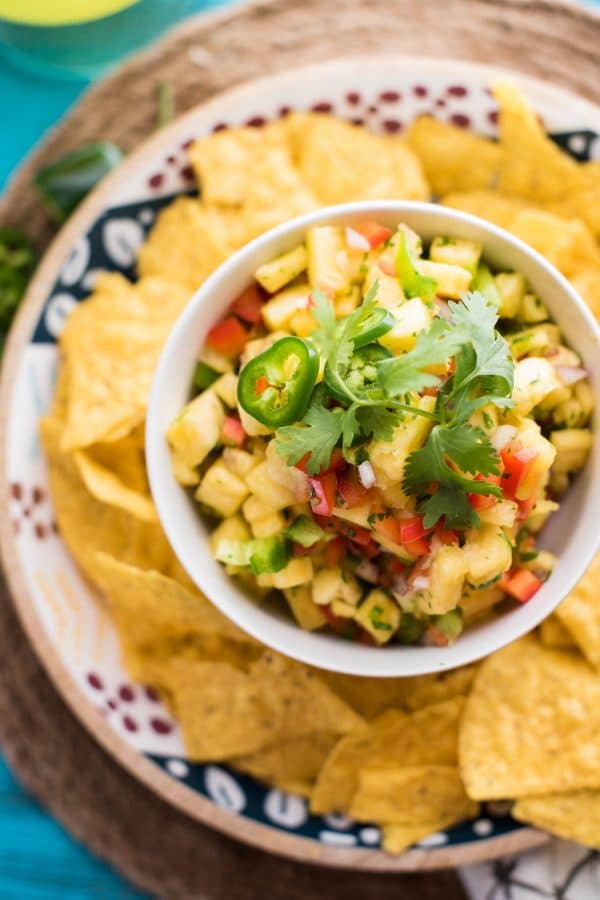 Quick + Crunchy Pineapple Salsa is perfect for a simple upgrade to summer dishes. Sweet fresh pineapple, crunchy bell peppers, and just a small jalapeño kick.