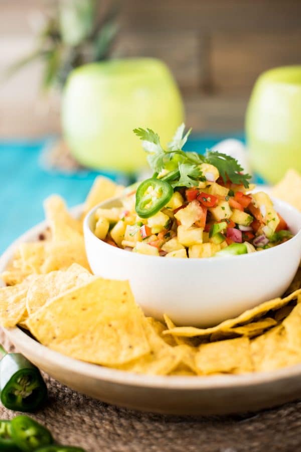 Quick + Crunchy Pineapple Salsa is perfect for a simple upgrade to summer dishes. Sweet fresh pineapple, crunchy bell peppers, and just a small jalapeño kick.