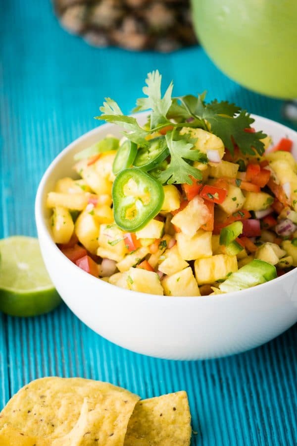 Quick + Crunchy Pineapple Salsa is perfect for a simple upgrade to summer dishes. Sweet fresh pineapple, crunchy bell peppers, and just a small jalapeño kick.