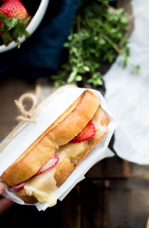 Melty, creamy brie cheese, sweet ripe summer strawberries, and a hint of fresh thyme sandwiched between crisp, buttery country white bread for the ultimate summer grilled cheese.