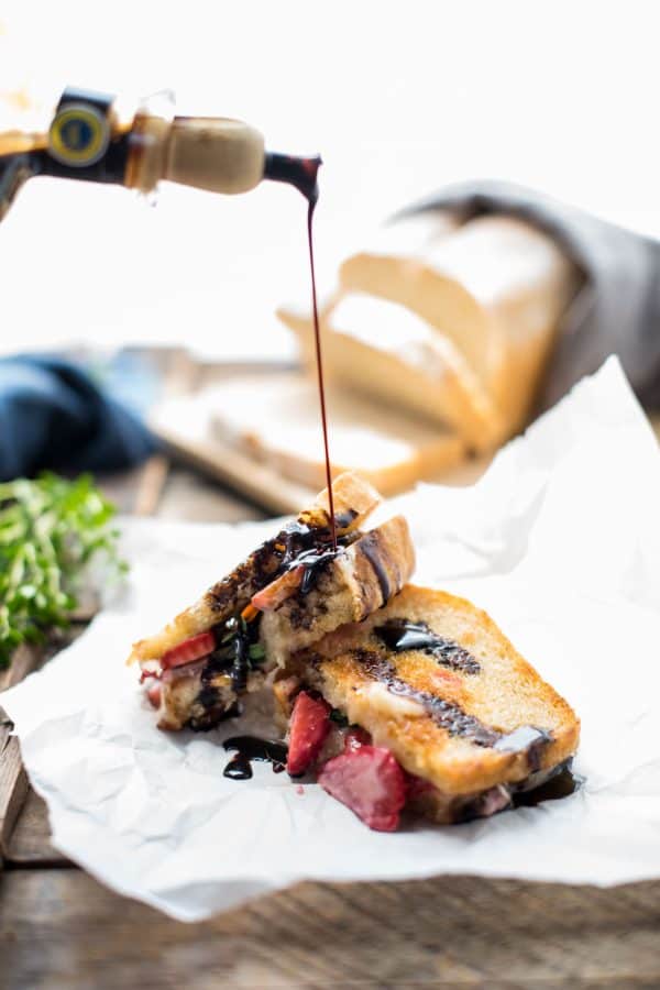 Melty, creamy brie cheese, sweet ripe summer strawberries, and a hint of fresh thyme sandwiched between crisp, buttery country white bread for the ultimate summer grilled cheese.