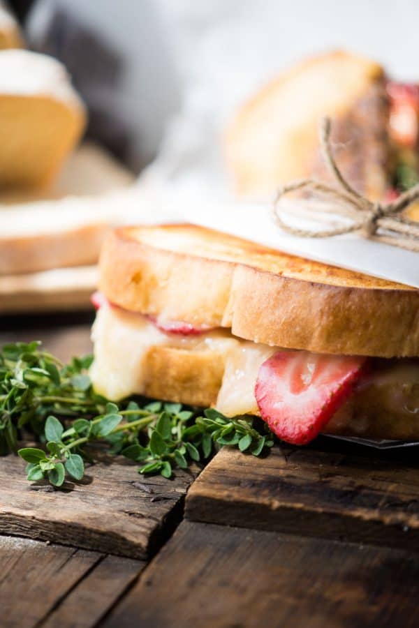 Melty, creamy brie cheese, sweet ripe summer strawberries, and a hint of fresh thyme sandwiched between crisp, buttery country white bread for the ultimate summer grilled cheese.