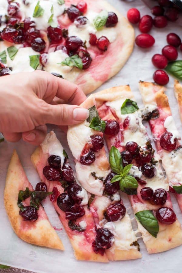 A year round snack that comes together in a pinch! Cranberry Basil Flatbreads are full of fresh, sweet and savory flavors with gooey burrata - perfectly stackable!