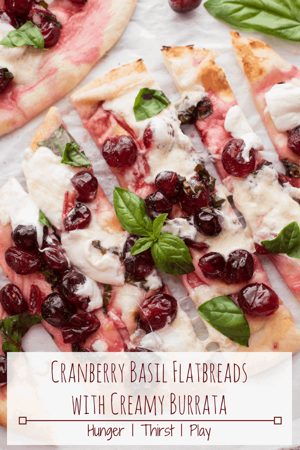 A year round snack that comes together in a pinch! Cranberry Basil Flatbreads are full of fresh, sweet and savory flavors with gooey burrata - perfectly snackable! #cranberries #flatbreads #appetizer #easyappetizer