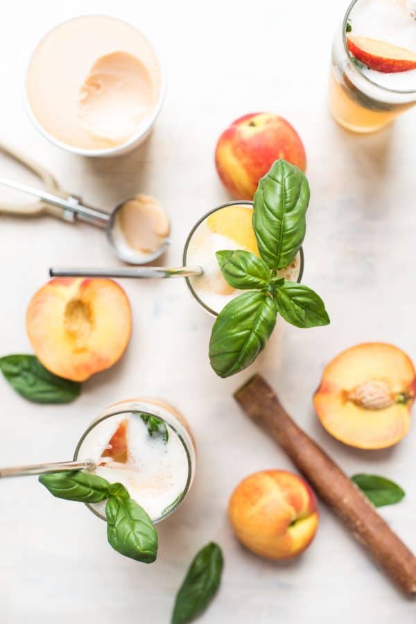 Summery Peach Basil Gin Floats are the perfect cold summer cocktail to cool off in the heat.