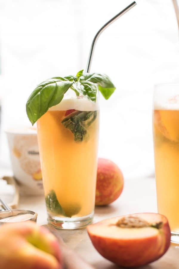 Summery Peach Basil Gin Floats are the perfect cold summer cocktail to cool off in the heat.