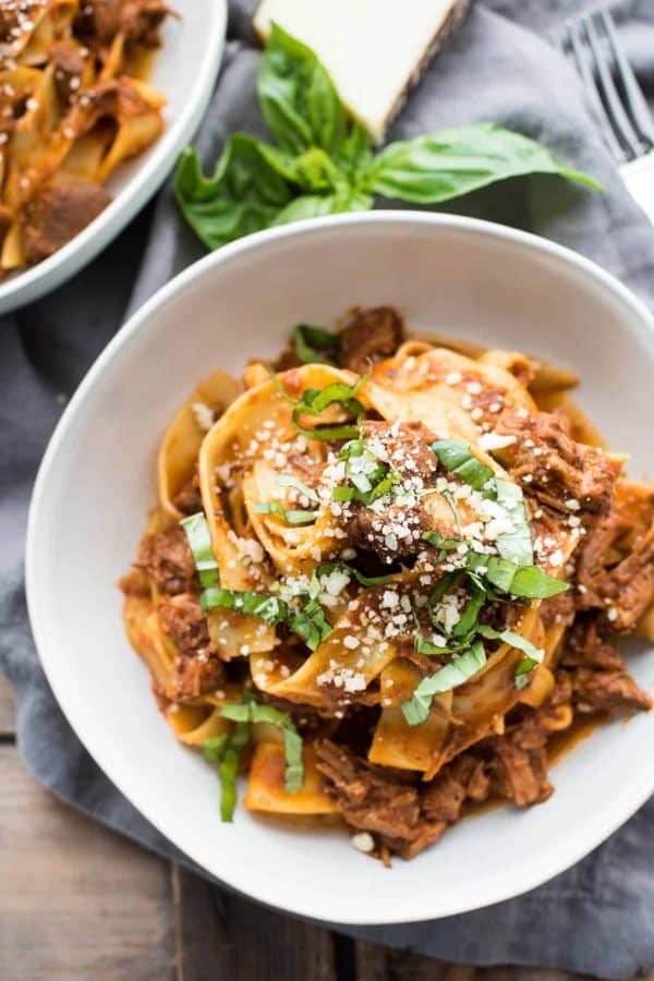 Overhead view of a bowl of lamb ragu with pappardelle pasta