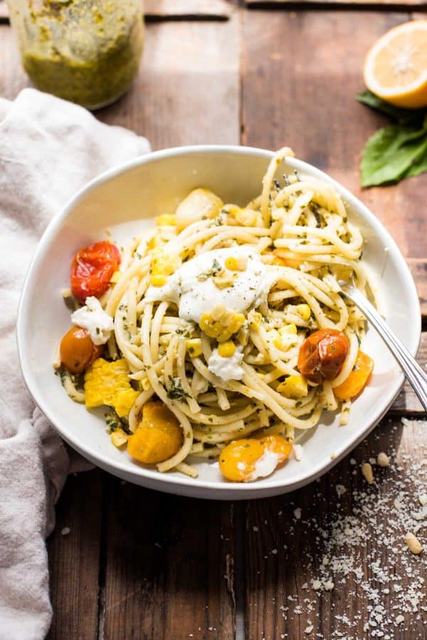 Single serving of veggie Pesto Pasta with tomatoes, corn, and burrata