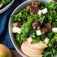 Overhead shot of autumn kale salad served in bowls