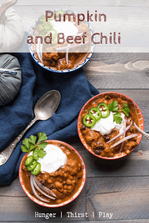 Warming, hearty pumpkin and beef chili is the perfect comfort food for cooler weather. Creamy pumpkin, savory beef and hearty beans in a spicy, seasoned tomato base. #beefchili #pumpkinchili