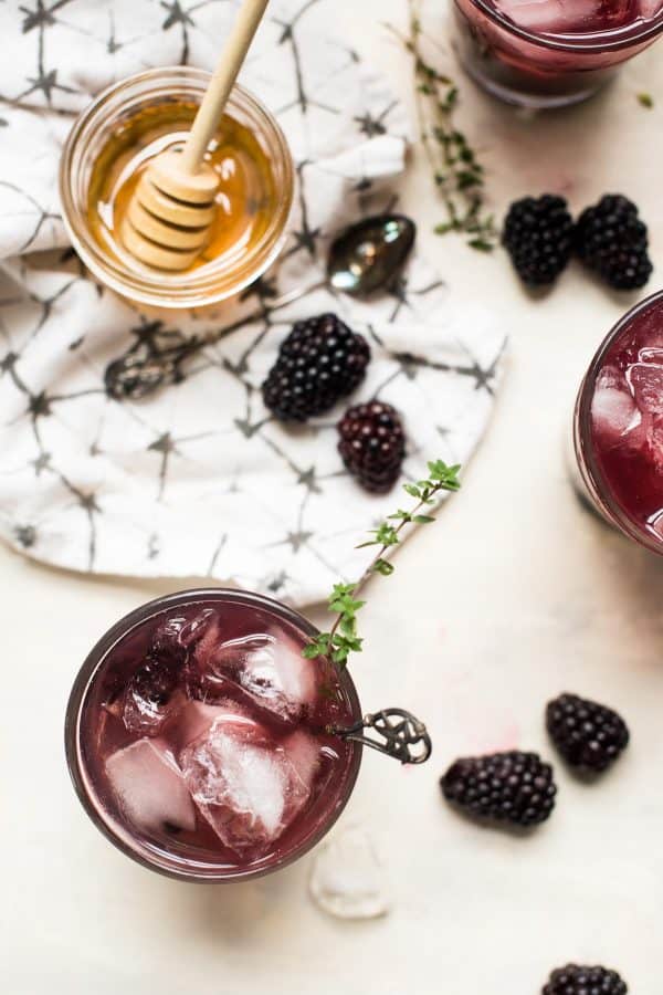 overhead view of blackberry honey bourbon smash cocktail