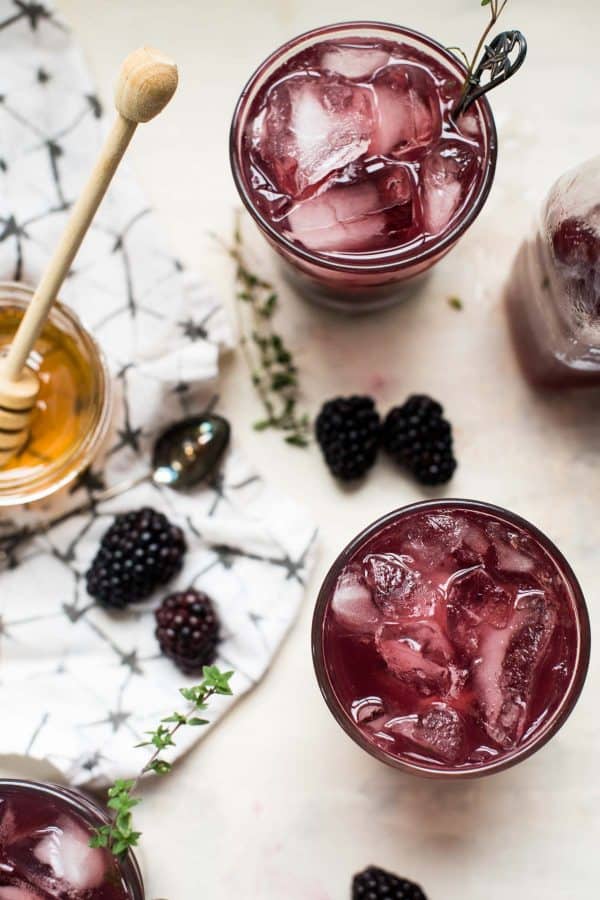 overhead view of blackberry honey bourbon smash cocktail