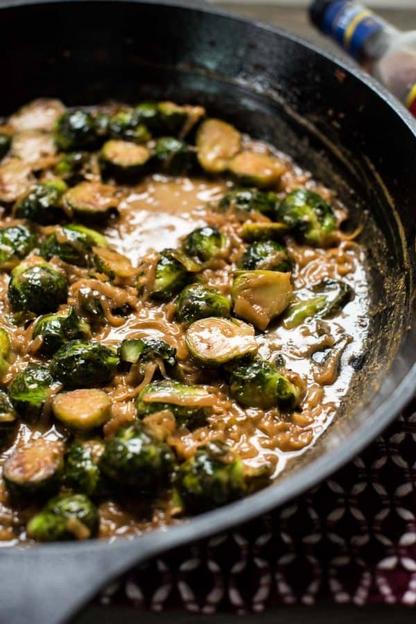 close up of marsala braised brussel sprouts in cast iron