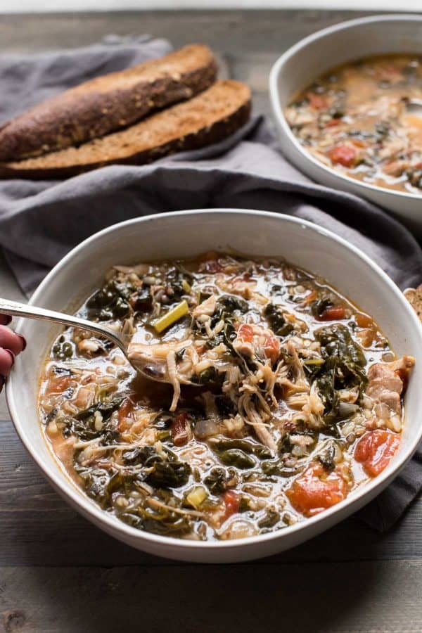 spoon full of hearty chicken and wild rice stew