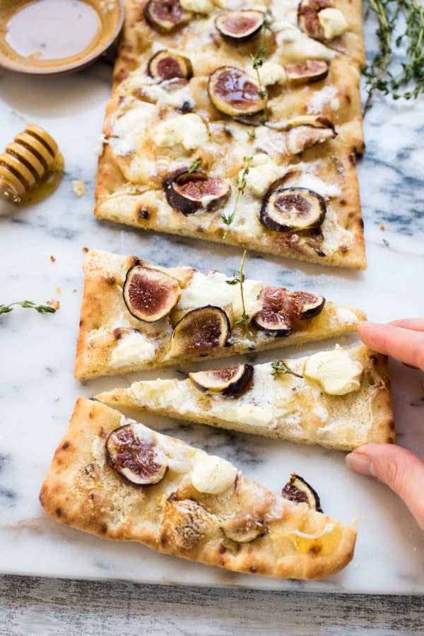 sneaking a slice of goat cheese flatbread