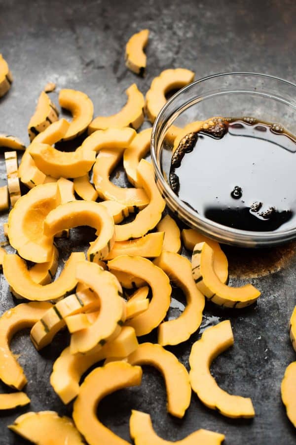 raw delicata squash about to be roasted with maple soy