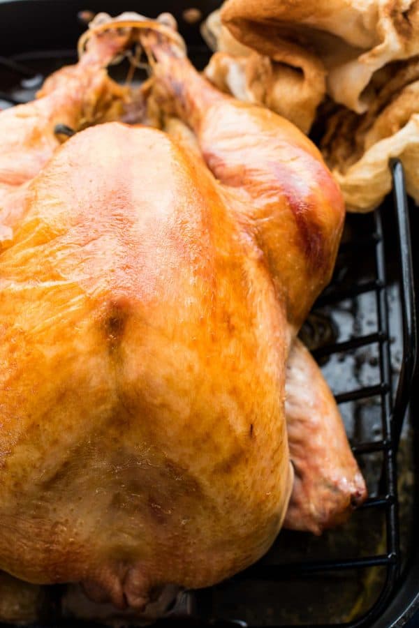 overhead photo of roasted thanksgiving turkey using the no-baste cheesecloth method