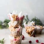 stacked cranberry rosemary muffins with white chocolate crumble