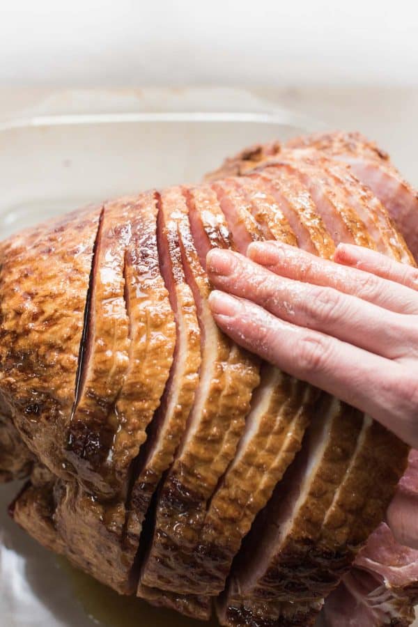 rubbing glaze into spiral ham layers