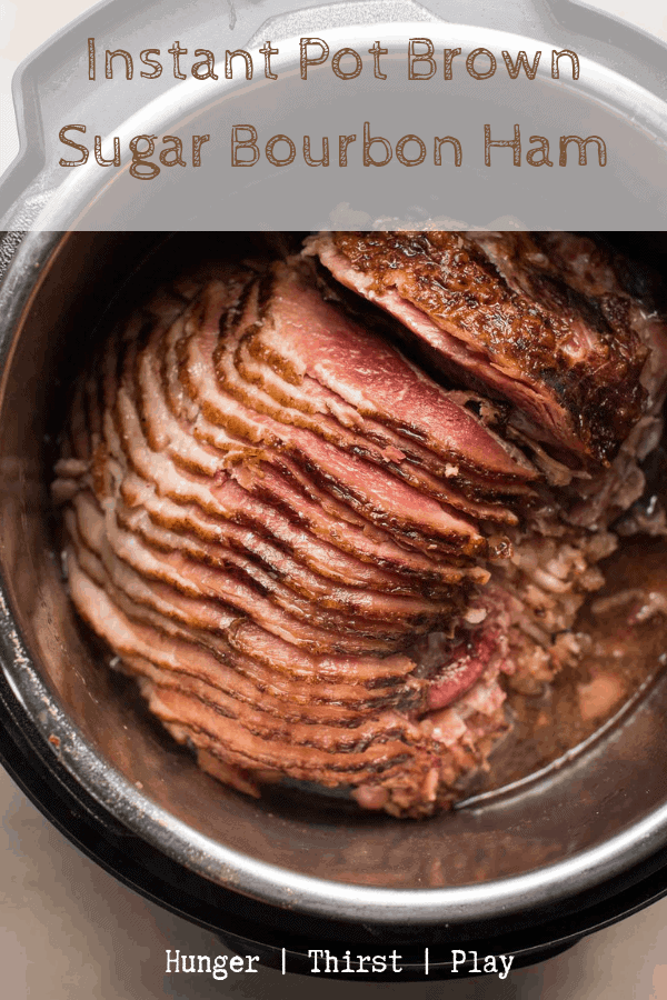You'll never make traditional ham again! Instant Pot Brown Sugar Bourbon Ham has a sweet, crunchy glaze and lots of sweet and warming flavors baked right in that takes just minutes to cook. #spiralham #instantpot #holidays