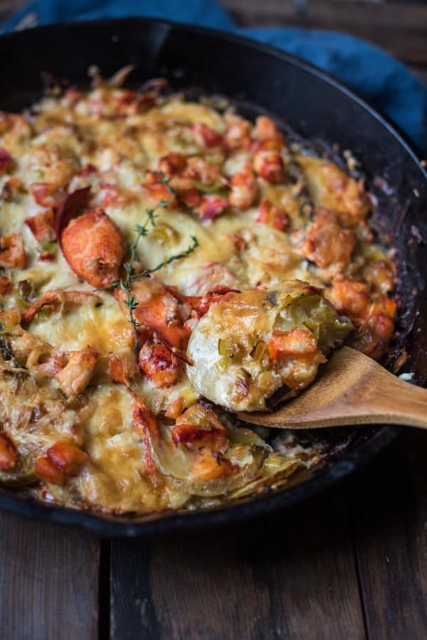 scooping out a gooey piece of leek and lobster potato gratin