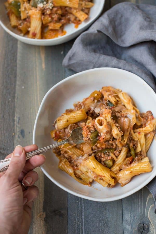 a forkful of sausage and peppers pasta bake