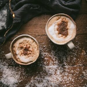 overhead image of gingerbread lattes in white mugs