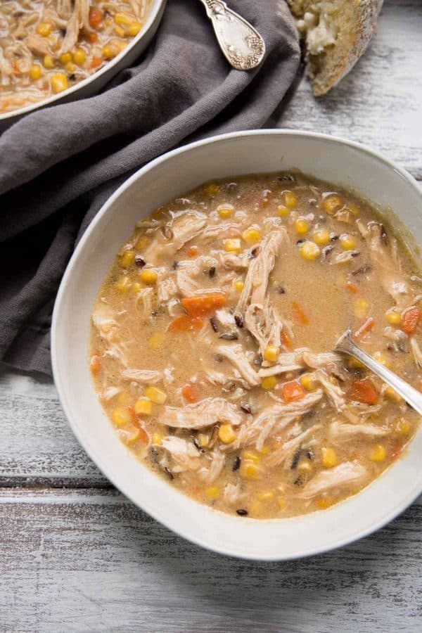 overhead view of a bowl of creamy chicken and wild rice soup