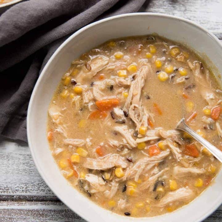 overhead view of a bowl of creamy chicken and wild rice soup