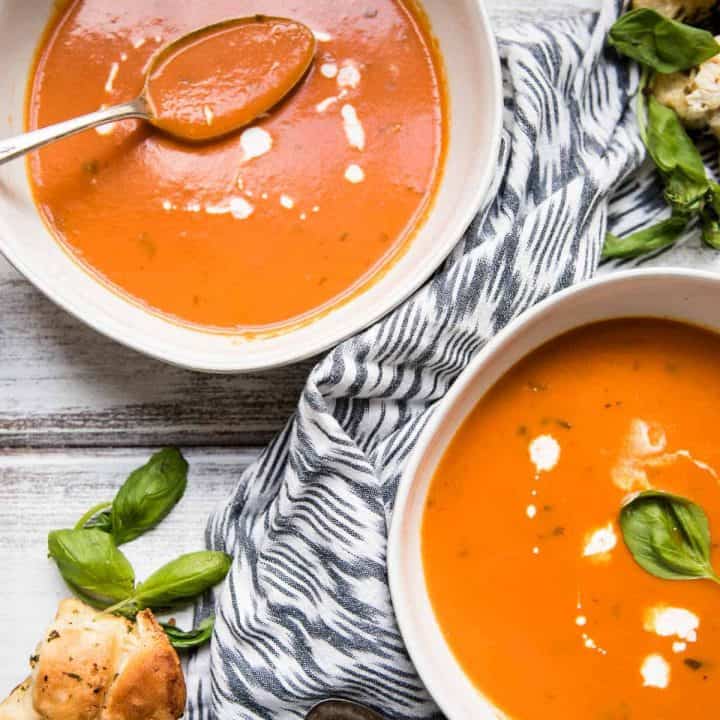 Overheat view of two bowls of tomato soup