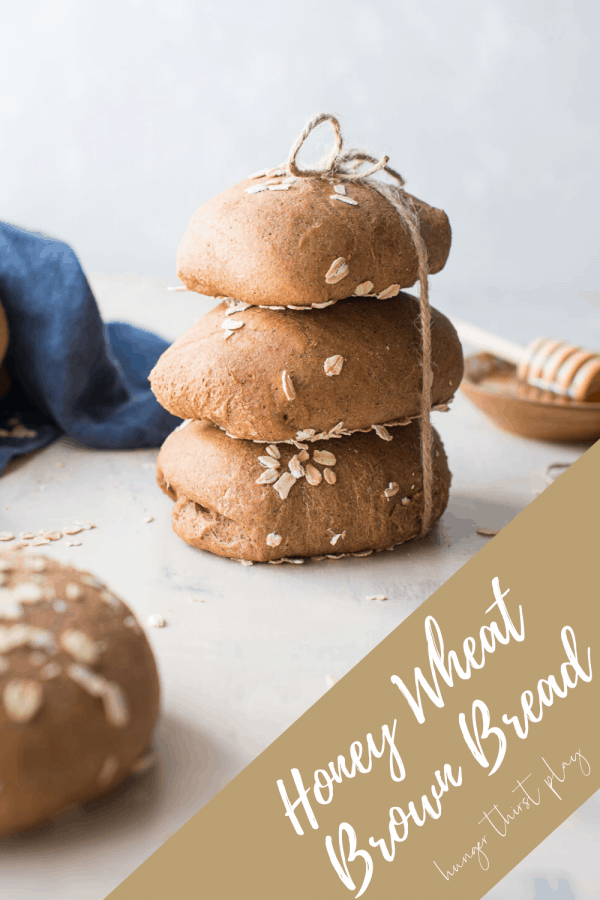 honey wheat brown bread rolls stacked