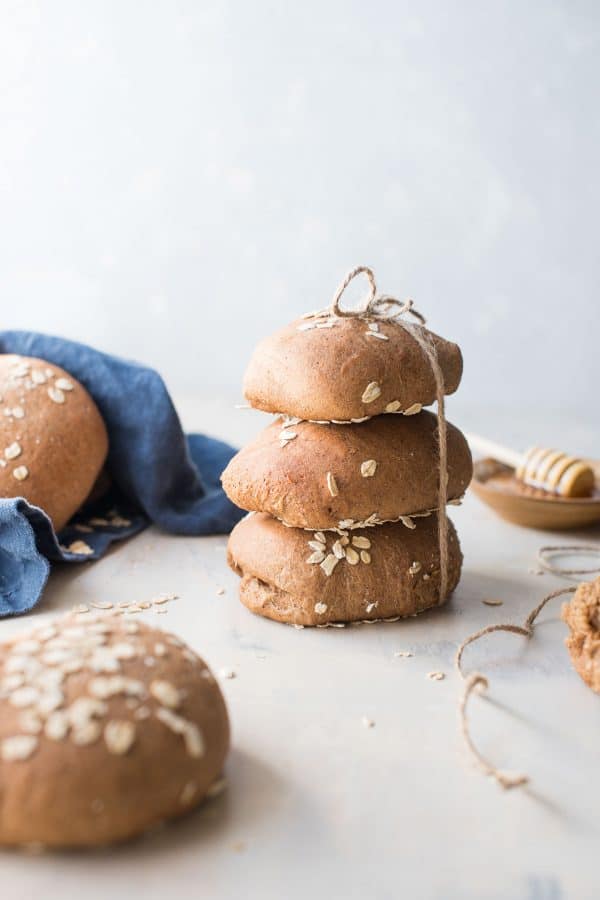 stacked rolls of honey wheat brown bread