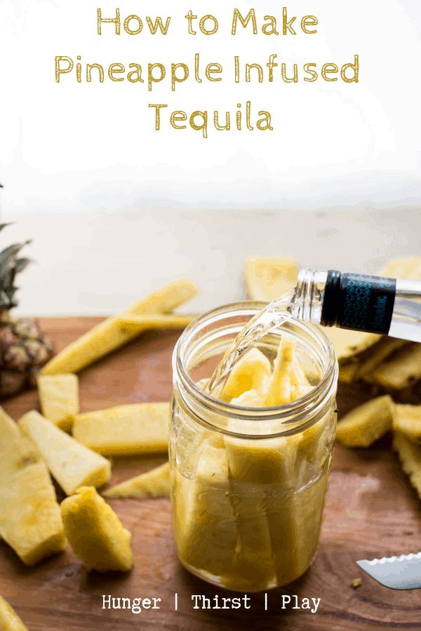 tequila pouring over fresh cut pineapple