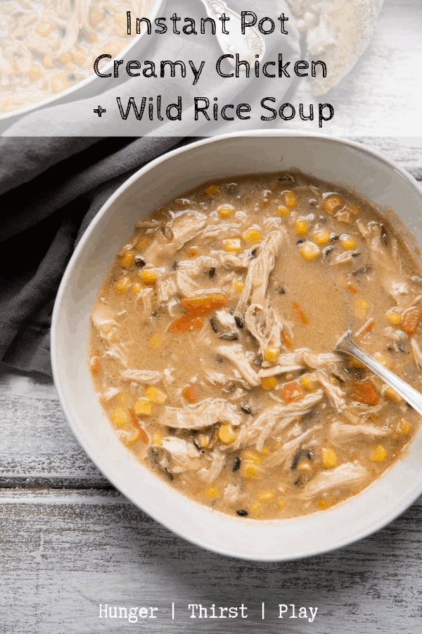 Instant Pot Creamy Chicken and Wild Rice Soup is the perfect comfort food soup. Healthy vegetables, hearty wild rice, and pulled chicken in a creamy chicken stock based broth. #instantpot #chickenandrice